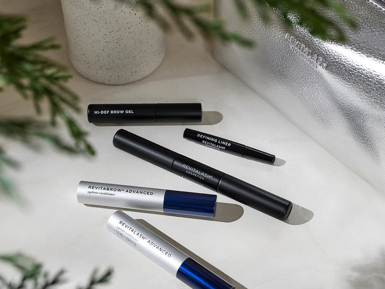 Image of a tube of RevitaBrow Advanced, Double-Ended Volume Set, a mini Defining Liner Eyeliner, and a mini Hi-Def Brow Gel