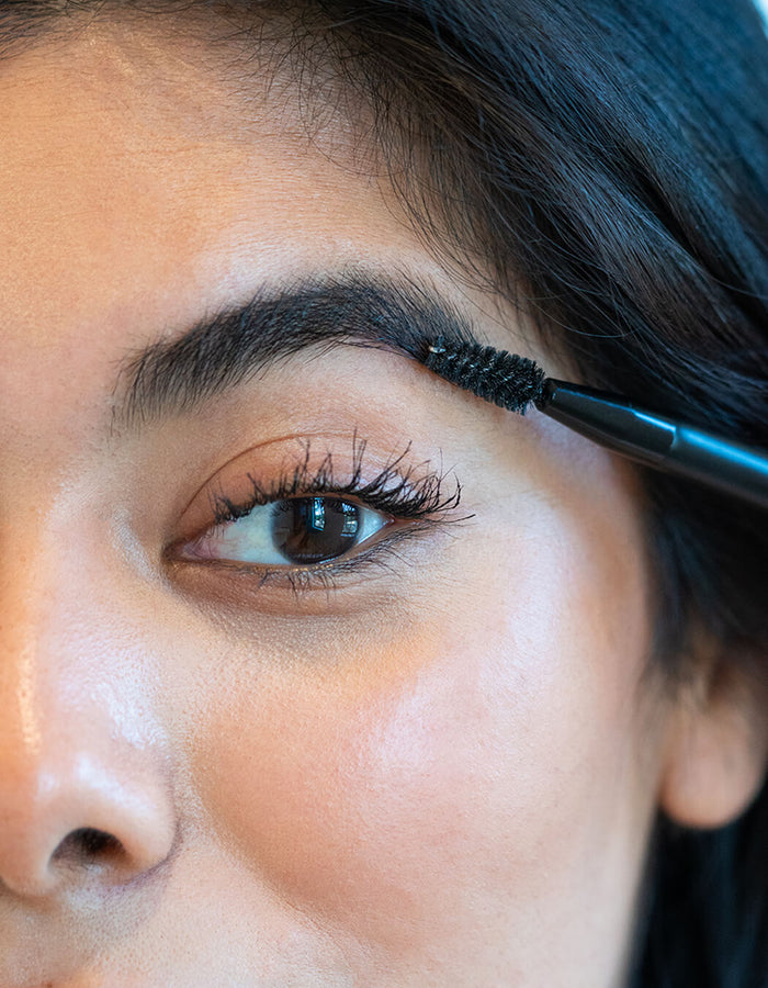 Grooming brows with a spoolie